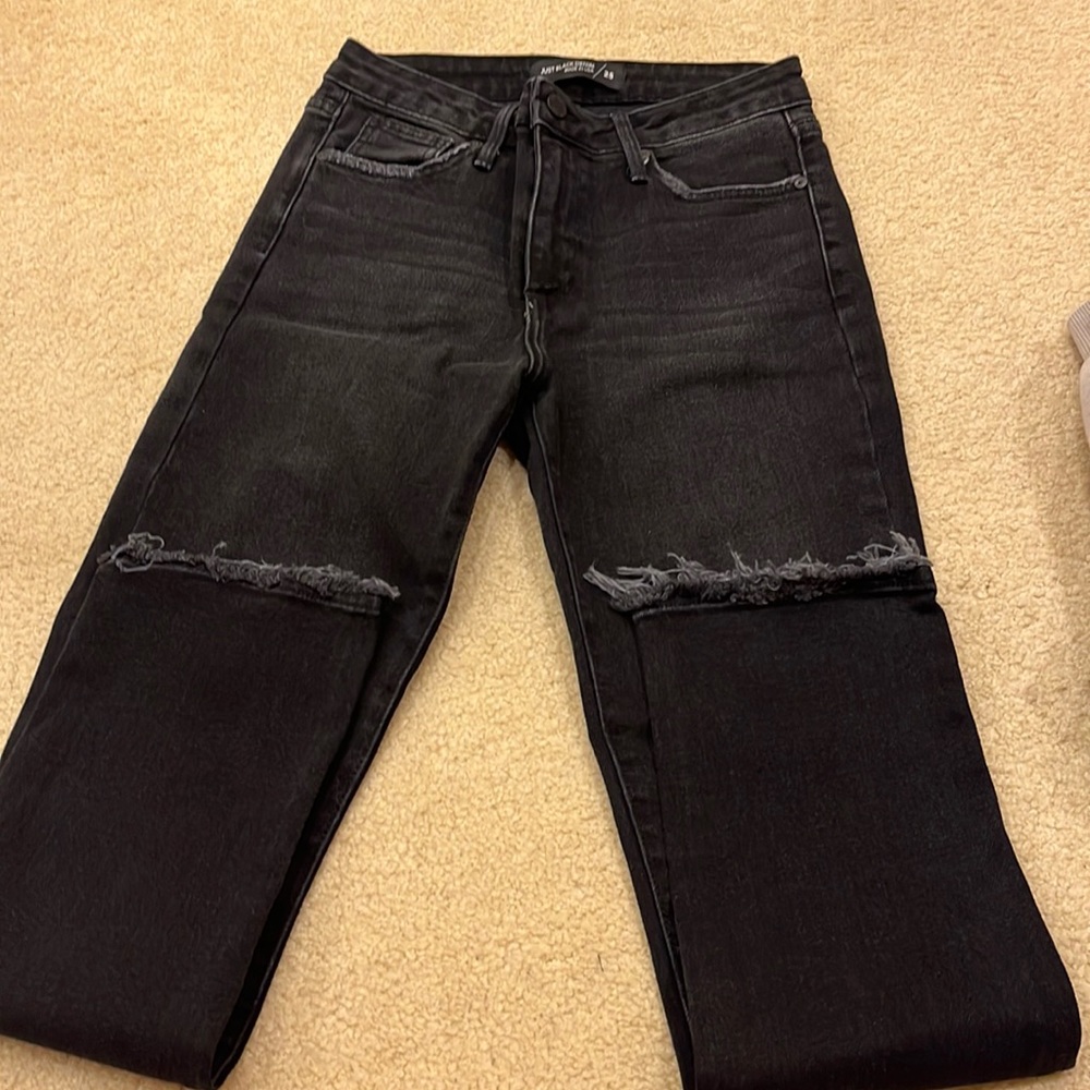 Just black denim jeans size 25 waist fringed bottom. No rips elsewhere
